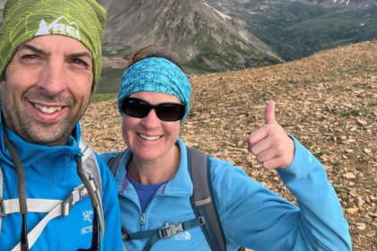 man and woman hiking a mountain