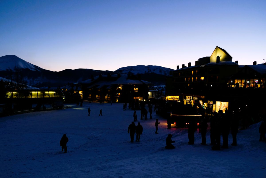 base of ski mountain lit up at night
