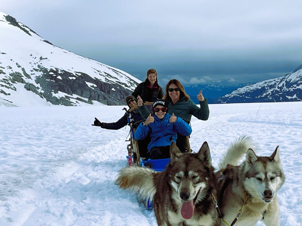 dog sled with family