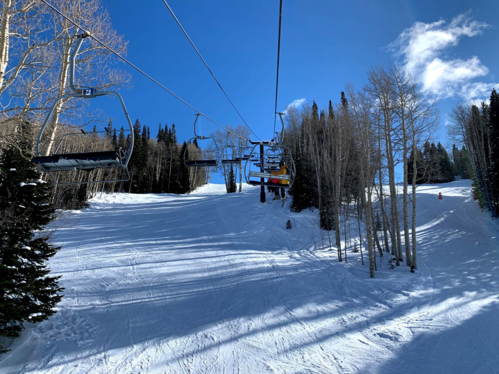 people riding ski lift