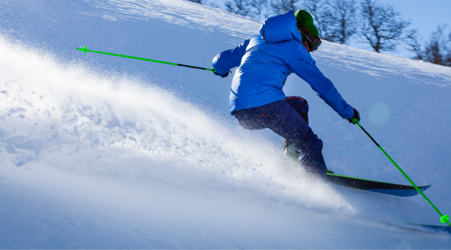 person skiing down mountain