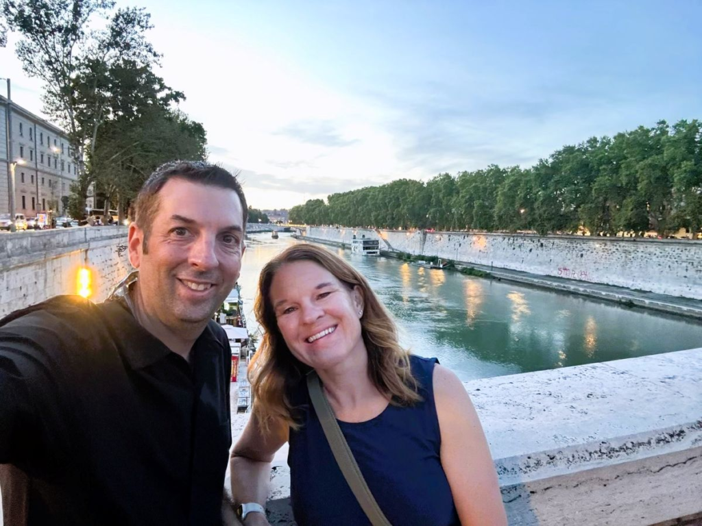man and woman in front of Tiber River in Rome